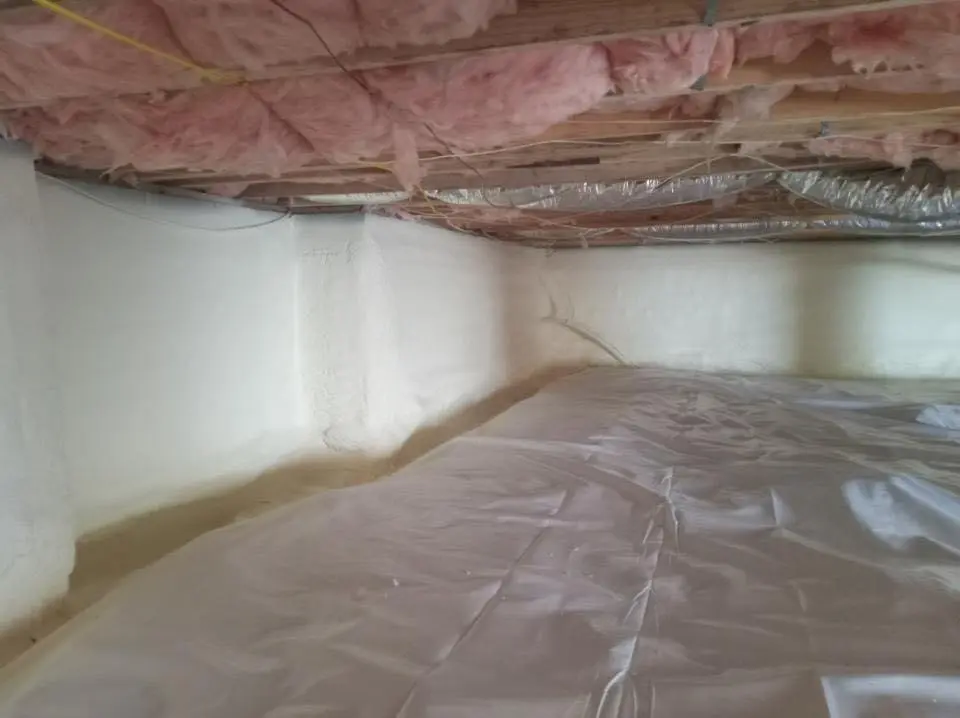 Crawl space encapsulation with closed-cell spray foam for Storm Damage Roof Repair in Bensville